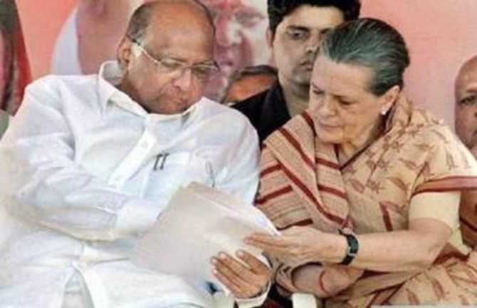 Congress President Sonia Gandhi with Nationalist Congress Party President Sharad Pawar, left. 