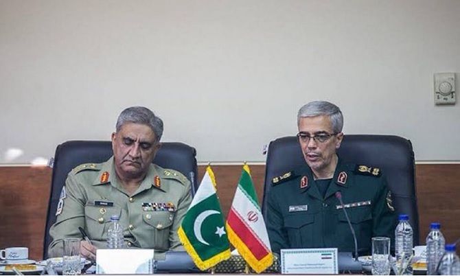 General Bajwa, left, with Major General Mohammad Hossein Baqeri, chief of staff of the Iranian armed forces.