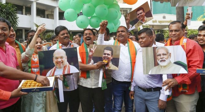 Bharatiya Janata Party supporters celebrate the formation of a BJP government outside the party headquarters in Mumbai, November 23, 2019. Photograph: PTI Photo