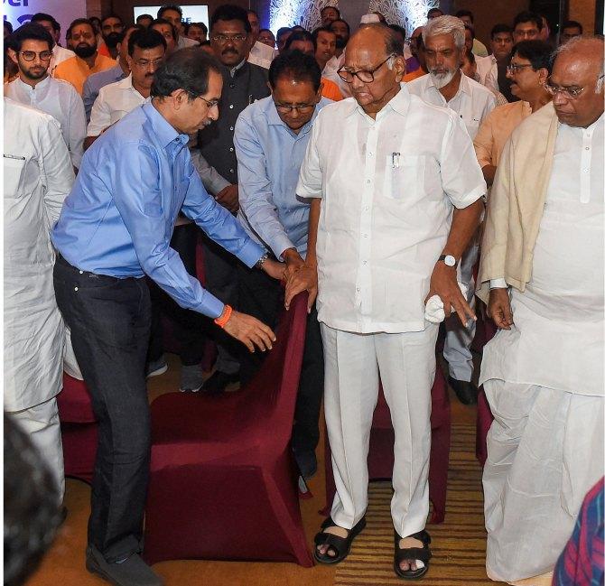 Sharad Pawar, Uddhav Thackeray and senior Congress leader Mallikarjun Kharge with Nationalist Congress Party, Congress and Shiv Sena MLAs. Photograph: Mitesh Bhuvad/PTI Photo