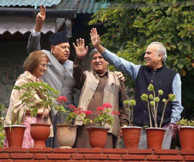 IMAGE: Dr Farooq Abdullah, second from left, and his wife Molly, with National Conference Lok Sabha MPs Akbar Lone, second from right, and Hasnain Masoodi, right, in Srinagar, October 6, 2019