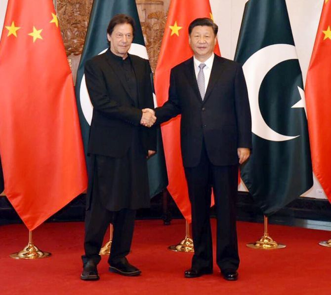 Chinese President Xi Jinping, right, with Pakistani Prime Minister Imran Khan in Beijing, October 9, 2019. 