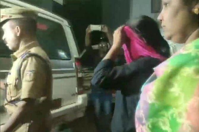 Jollyamma Joseph being arrested in connection with the deaths of six members of a family over a period of 14 years in Koodathai village, Kozhikode district, Kerala. Photograph: ANI