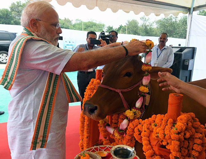 Some people get alarmed on hearing 'Om', 'cow': Modi - Rediff.com India News