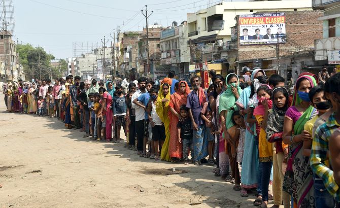 People queue up for ration in Patna