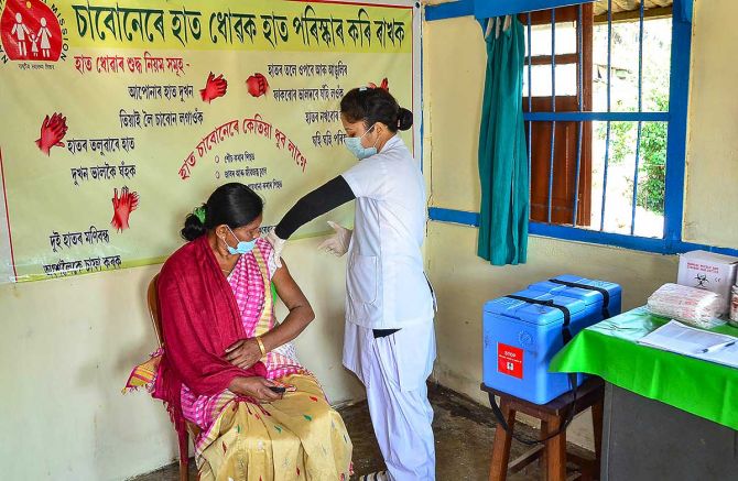 A medic demonstrates the administration of COVAXIN, an Indian government-backed experimental COVID-19 vaccine, to a health worker during its trials, at the Urban Primary Health Centre at Tezpur in Sonitpur district, Assam, December 29, 2020. Dry run has been conducted successfully in four states of Andhra Pradesh, Assam, Gujarat and Punjab. Photograph: PTI Photo