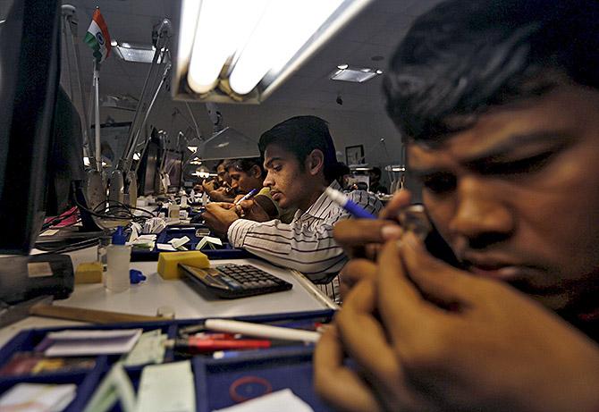 Craftsman at a diamond processing unit in Surat. Photograph: Amit Dave/Reuters