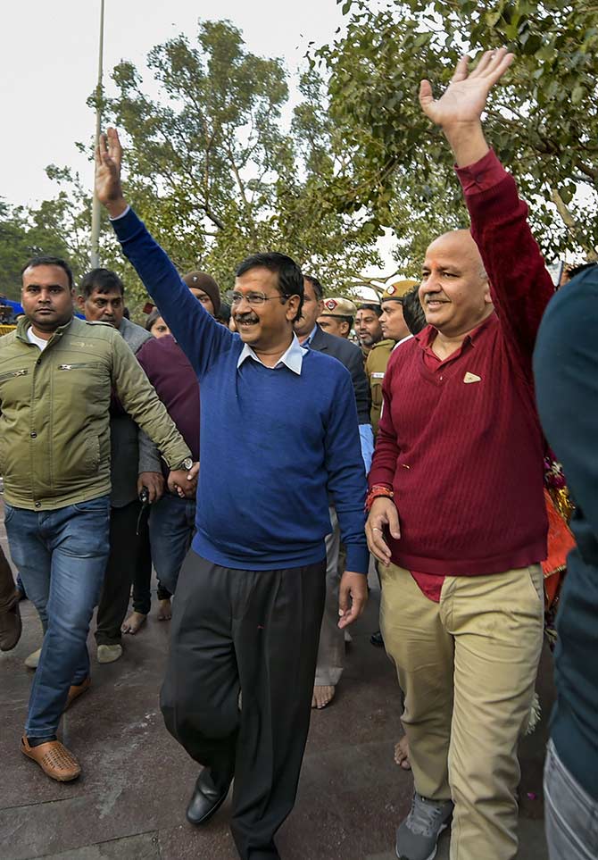 Arvind Kejriwal, left, and Manish Sisodia walk to the Hanuman Mandir at Connaught Place, New Delhi, February 11, 2020. Photograph: Vijay Verma/PTI Photo