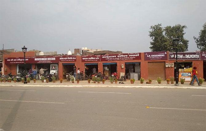 The signages on shops along the Trumps's route in Agra have been painted a similar maroon. Photograph: Neeraj P