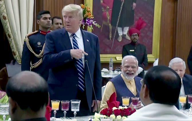 President Donald J Trump makes a point at President Ram Nath Kovind's banquet, which has Prime Minister Narendra Damodasdas Modi chuckling, February 25, 2020 