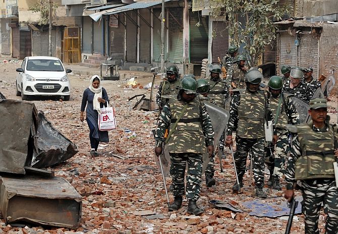 Security forces patrol a street in a riot-affected area in Delhi, February 26, 2020. Photograph: Adnan Abidi/Reuters