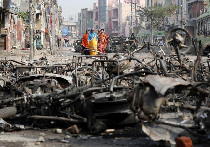 Charred remains of a vehicle in north-east Delhi during the riots