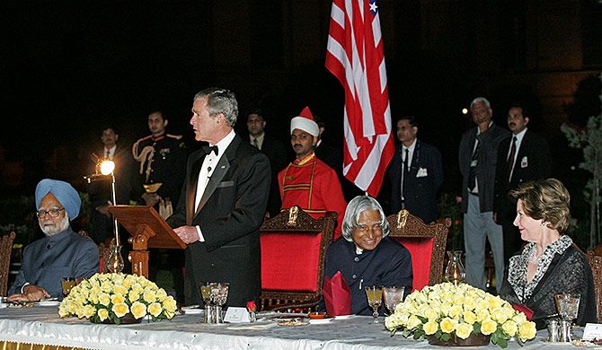 Then US president George W Bush at the State dinner as then prime minister Dr Manmohan Singh, then President A P J Abdul Kalam and then US First Lady Laura Bush look on at Rashtrapati Bhavan, March 2, 2006. Photograph: B Mathur/Reuters