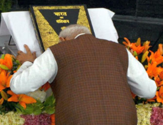 Prime Minister Narendra Modi bows before the Constitution of India