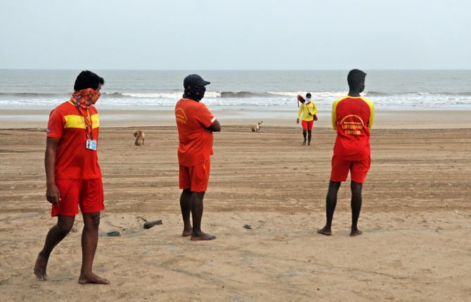 Lifeguards on the alert at Juhu beach, Mumbai. Photograph: Ashish Vaishnav / ANI Photo.