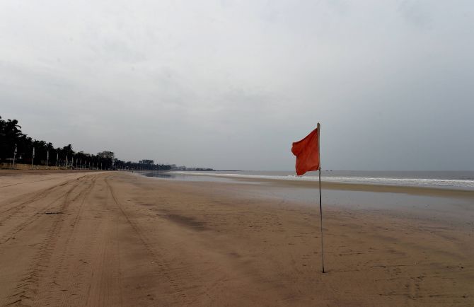 Red alert is put up on Mumbai's Juhu beach. Photograph: Kunal Patil / PTI Photo.