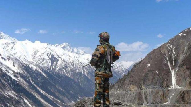 An Indian soldier stands guard in Ladakh. Photograph: PTI Photo