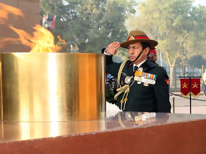 The Indian Army's then Adjutant General Lieutenant General Rakesh Sharma pays homage at Amar Jawan Jyoti on the occasion of the 33rd Corps Day of the Judge Advocate General Department, December 21, 2016.