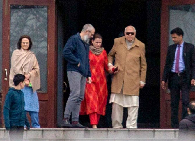 Dr Farooq Abdullah met his son Omar Abdullah on Saturday, March 14, a day after he was released from detention. Also in the photograph: Molly Abdullah, Dr Abdullah's wife, left, and Safiya Abdullah Khan, centre, between her father and brother. Photograph: Umar Ghani for Rediff.com