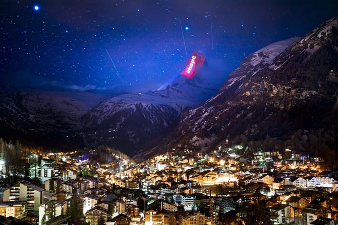 The iconic Matterhorn mountain is illuminated by Swiss light artist Gerry Hofstetter aiming to send messages of hope, support and solidarity to the ones sufferings from the global coronavirus disease, COVID-19, pandemic in the alpine resort of Zermatt, Switzerland