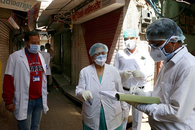 Health workers conduct a door-to-door survey for COVID-19 symptoms in Ajmer, March 28, 2020. Photograph: PTI Photo