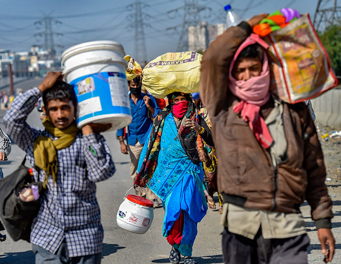 A group of migrants walk to their villages near the Delhi-UP border. Photograph: Ravi Choudhary/PTI Photo