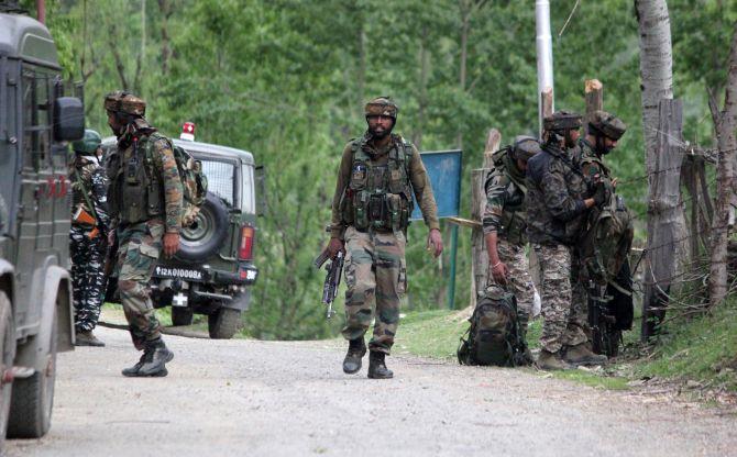 Indian Army soldiers at the end of the operation against terrorists in Handwara, north Kashmir, May 3, 2020. Photograph: Umar Ganie for Rediff.com