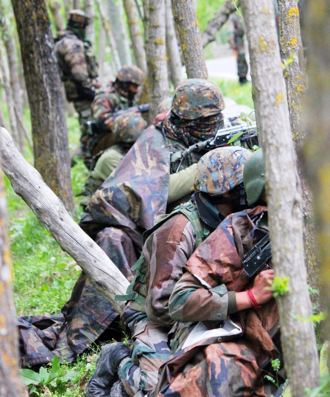 Indian Army soldiers in the Rajwar forest during the operation against terrorists in Handwara, north Kashmir, May 3, 2020. Photograph: Umar Ganie for Rediff.com