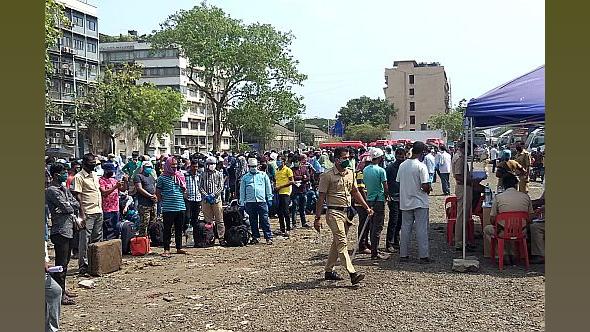 Migrant workers assemble to go home to Bengal