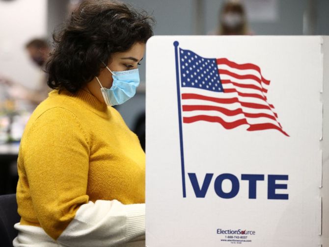 A woman votes at the Fairfax County Government Center in Fairfax, Virginia. Photograph: Hannah McKay/Reuters
