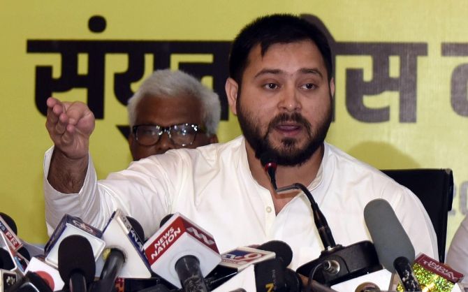 RJD leader Tejaswi Yadav addressing during a grand alliance press conference ahead of the Bihar Assembly Election. Photograph: ANI Photo