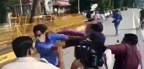 A video grab of the fisticuffs between the journalists