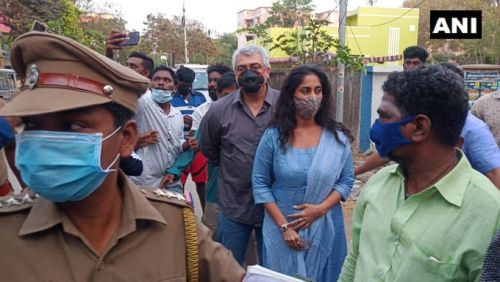 Actor Ajith Kumar and his wife Shalini arrive at a polling booth in Thiruvanmiyur