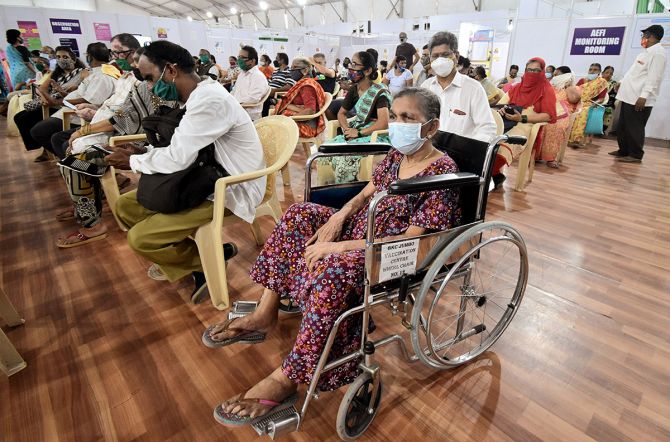 People wait to get a shot of the COVID-19 vaccine at a jumbo covid vaccination centre in Mumbai, April 15, 2021. Photograph: Deepak Salvi/ANI Photo