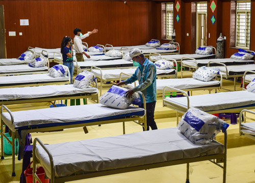 Hospital beds being prepared at a Covid facility