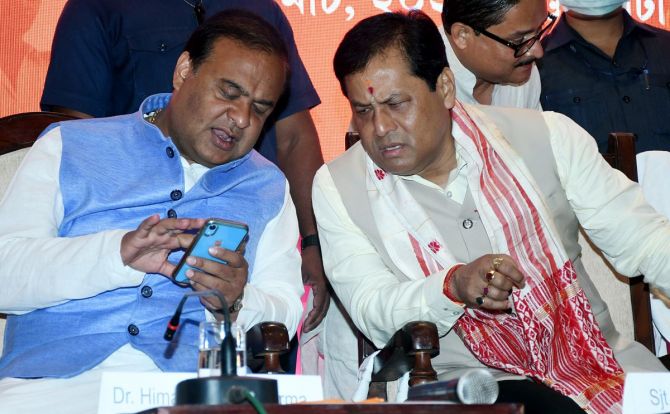 Bharatiya Janata Party leaders Himanta Biswa Sarma, left, with Sarbananda Sonowal at the release of the BJP manifesto for the Assam assembly election in Guwahati, March 23, 2021. Photograph: Pitamber Newar/ANI Photo