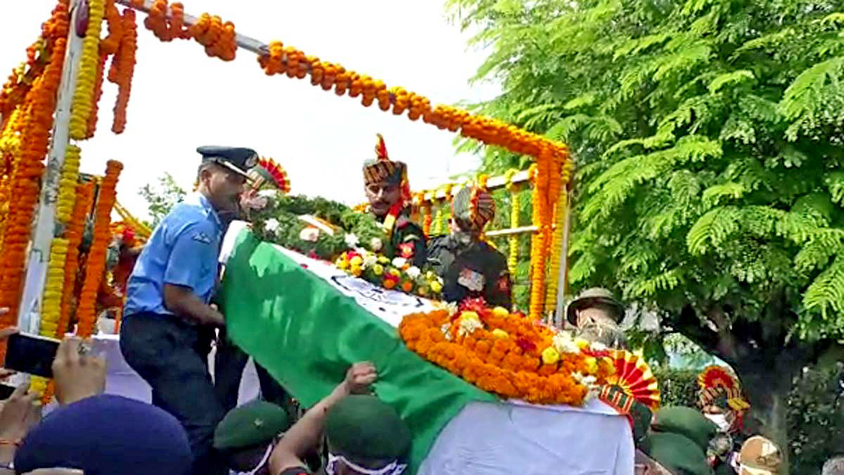 Army and Air Force personnel carry the mortal remains of Col Viplav Tripathi, Commanding officer of Khuga Battalion of the Assam Rifles.