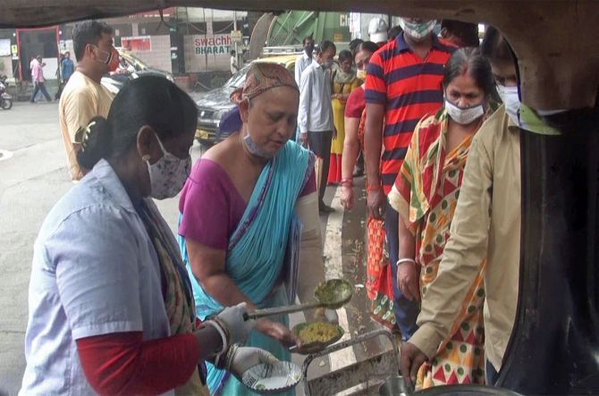 Bulbul Roy serving food to the needy