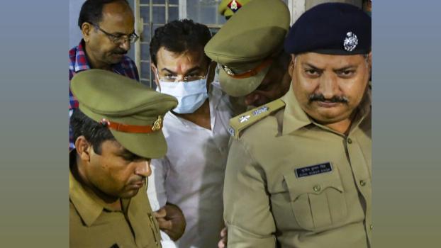 File pic. Ashish Mishra with policemen during his arrest in 2021