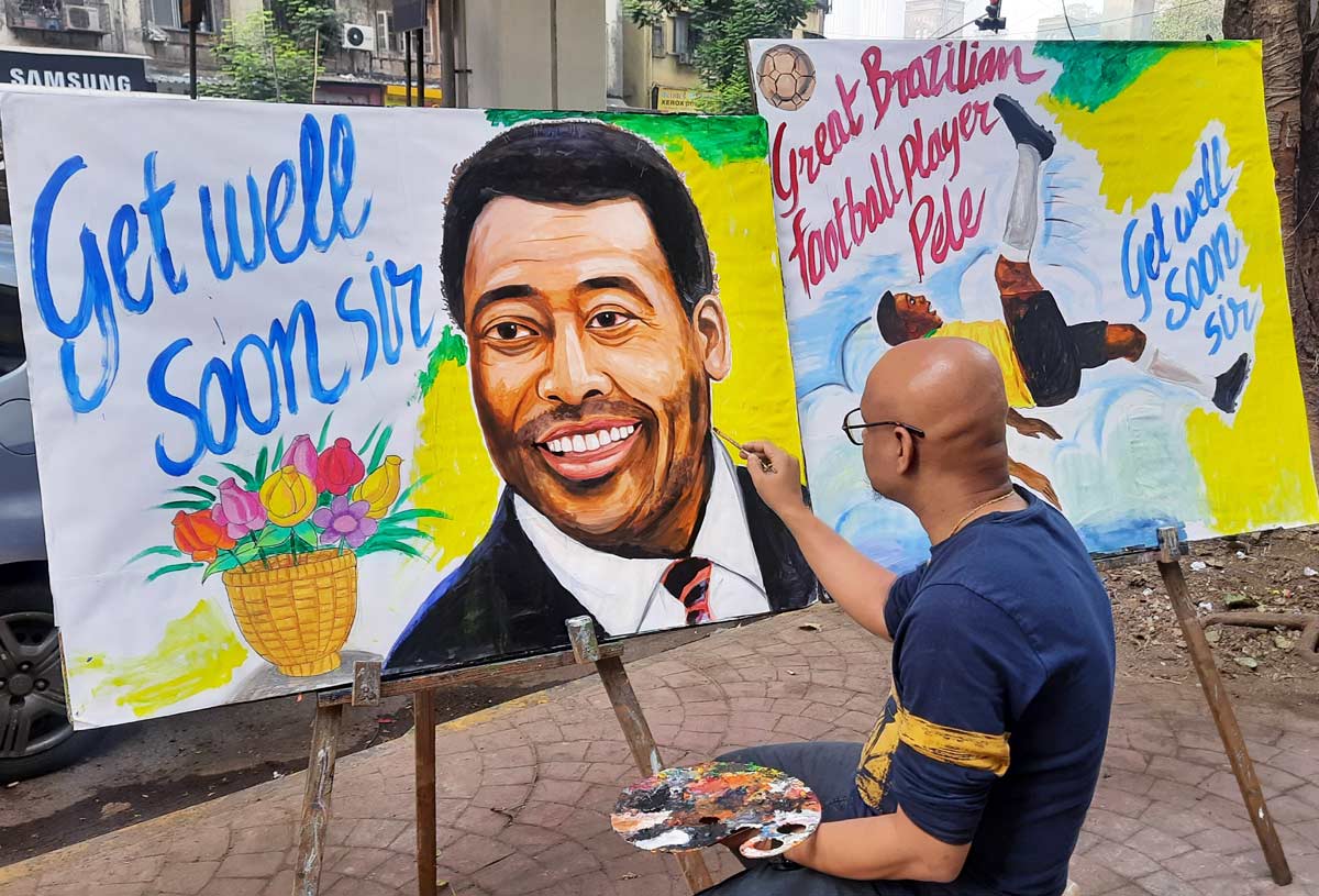 Gurukul School of Art teacher Sagar Kambli draws a painting of football legend Pele in Mumbai.