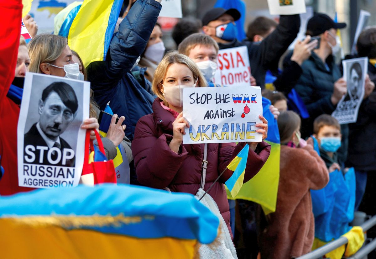 Ukrainians residing in Japan hold placards and flags during a protest rally