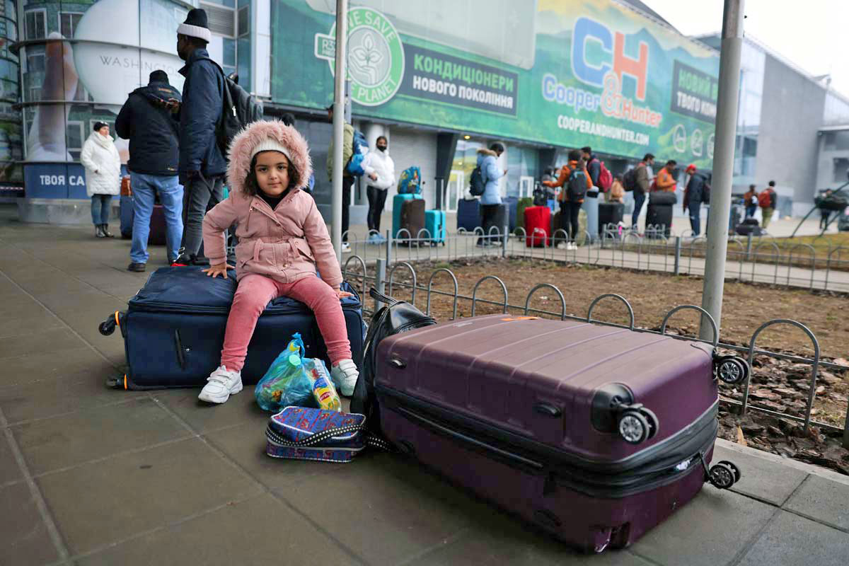 People wait to return to the city at Kyiv airport. REUTERS/Umit Bektas