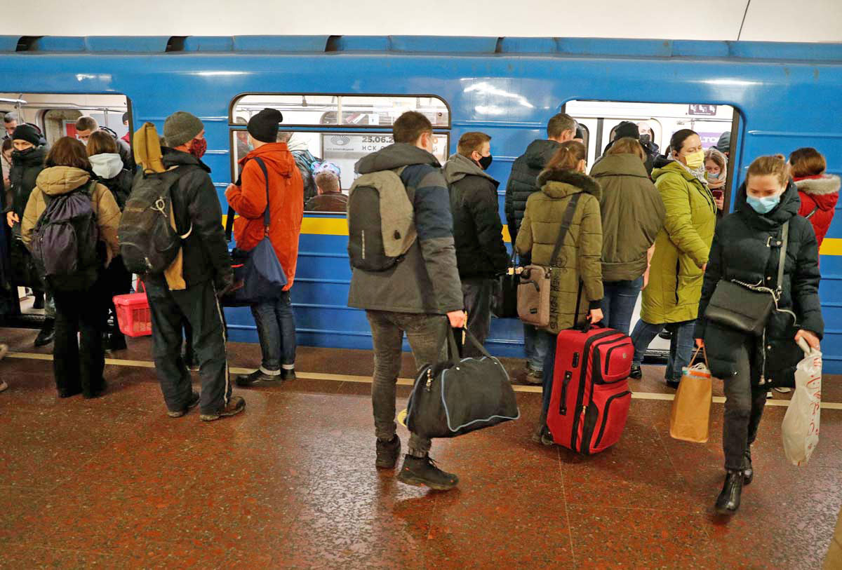 People ride the subway in Kyiv