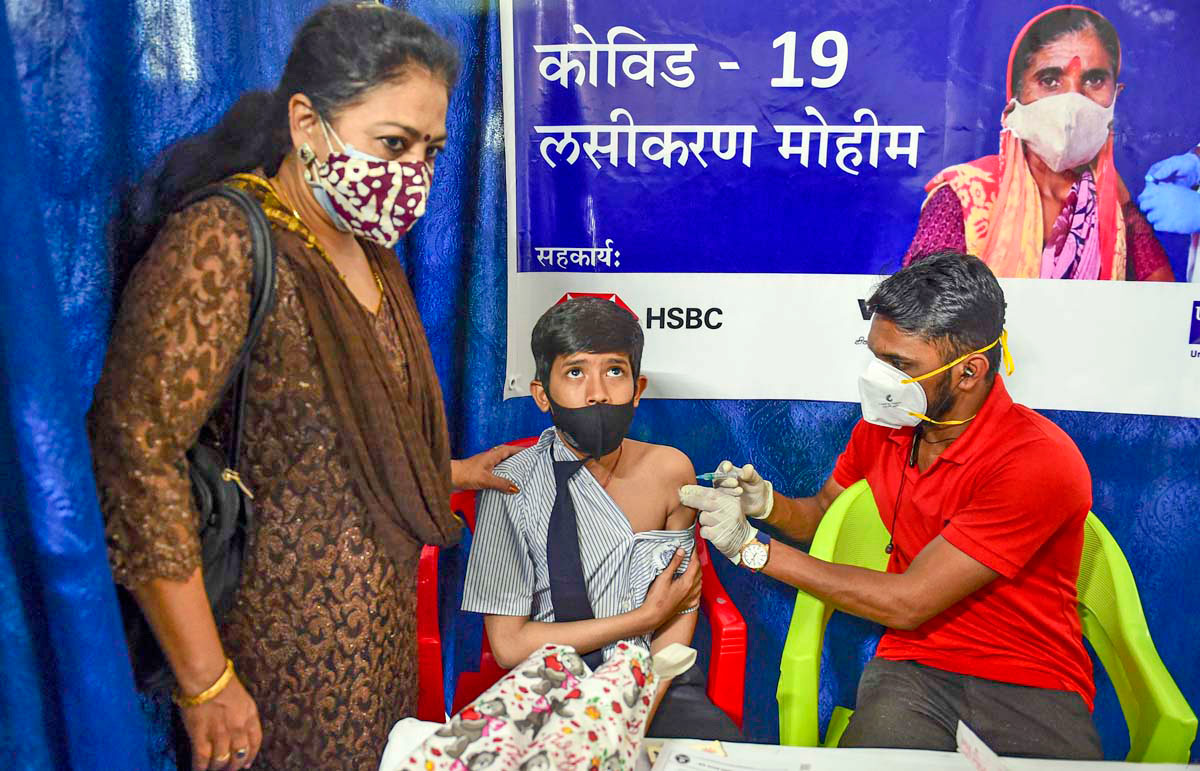 A child gets his vaccination against Covid