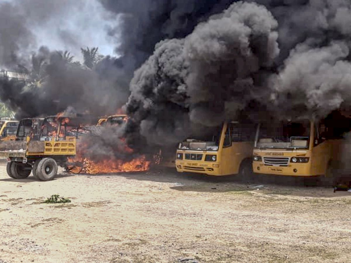 Protesters set afire school buses after student's death