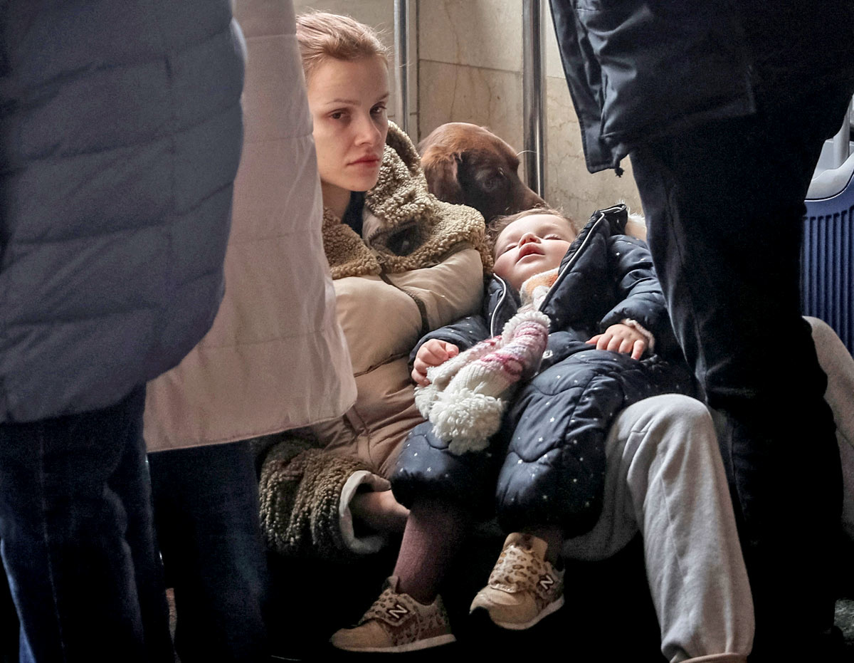 A worried mother waits to board a train. Gleb Garanich/Reuters