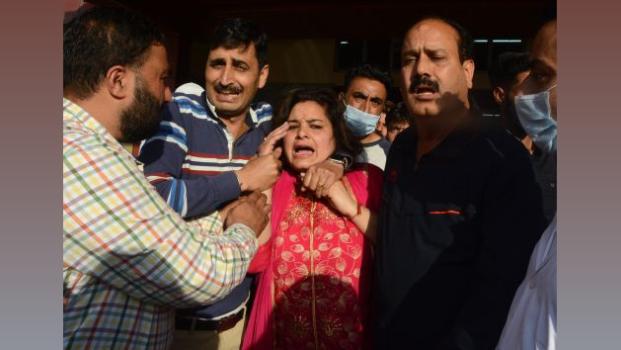 The distraught family of Rahul Bhat. Pic: Umar Ganie