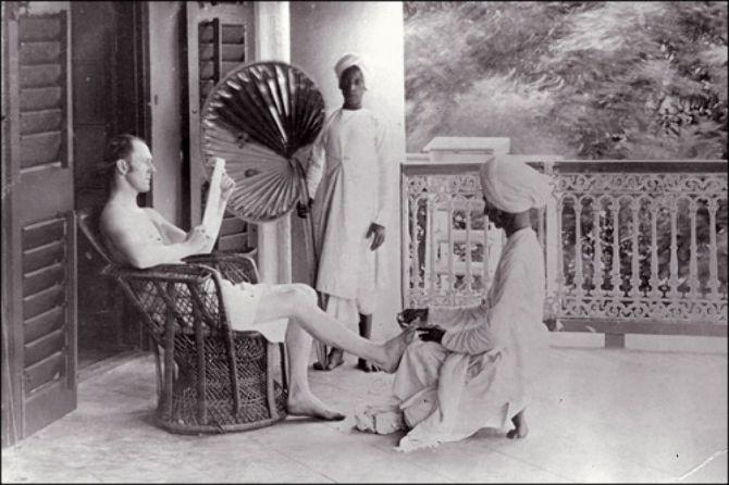 A British saheb with his Indian servants