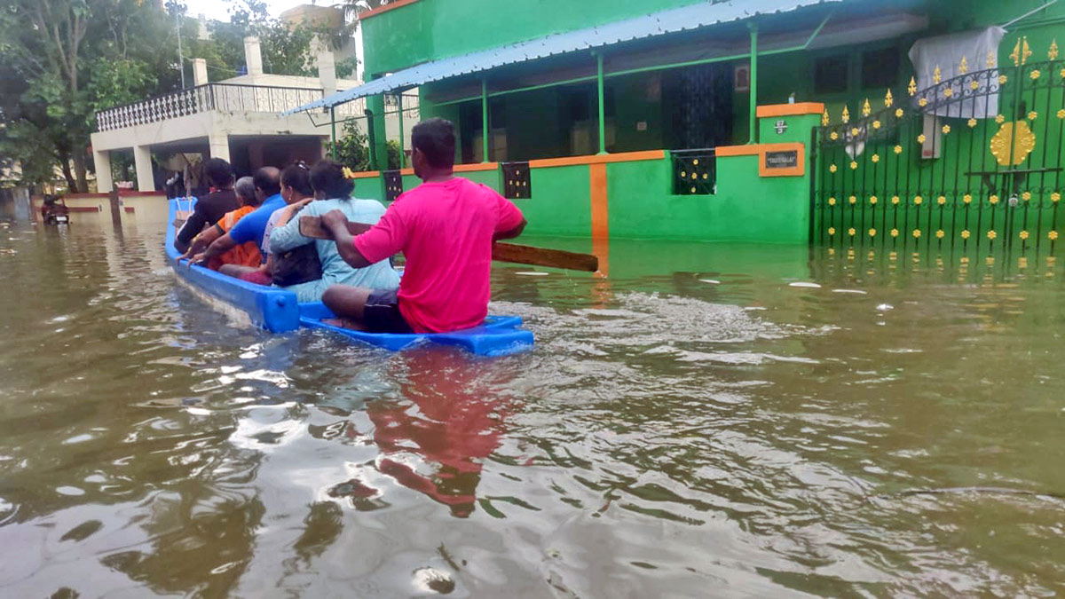People use a boat to shift to a safer place from a flooded area in Chennai/ANI