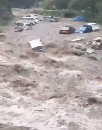 Cars parked along the Beas river in Manali washed away